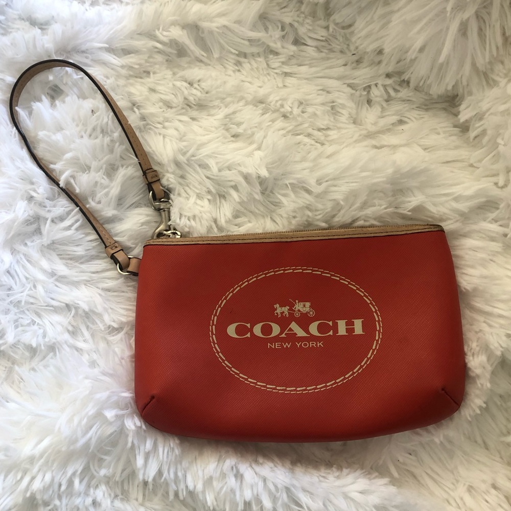 reddish orange coach wristlet